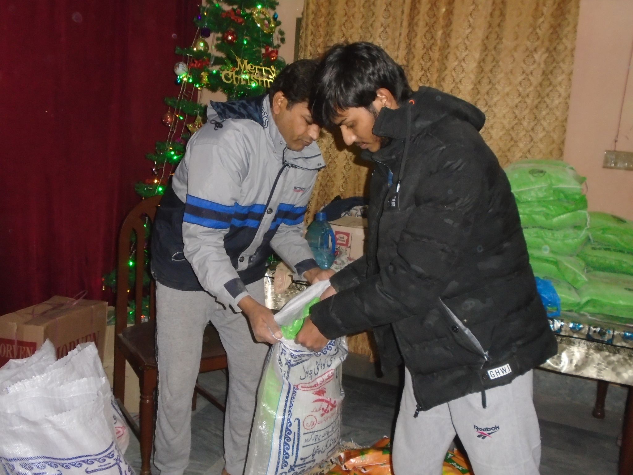 Paster-Pervaiz-and-brother-Joseph-creating-bags-to-give-away