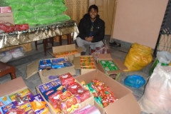 Brother-Joseph-with-the-groceries-preparing-for-distribution